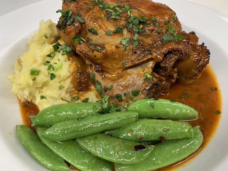 Pork Ossobuco with parmesean-crème fraîche mashed potatoes & braised greens